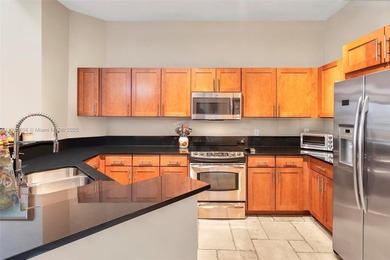 Discover this rare 2-bedroom, 2-bath plus den residence at The