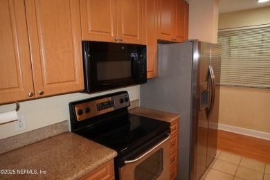 Over $10,000 price improvement! Mediterranean style end-unit
