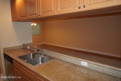 Over $10,000 price improvement! Mediterranean style end-unit