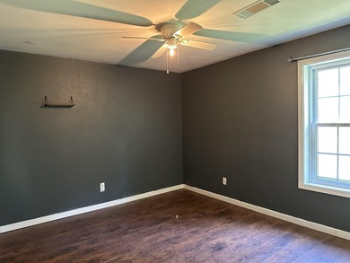 Affordable 3 or 4 bedroom home on Lake Catherine with permitted