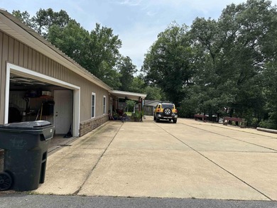 Affordable 3 or 4 bedroom home on Lake Catherine with permitted