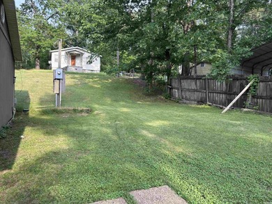 Affordable 3 or 4 bedroom home on Lake Catherine with permitted