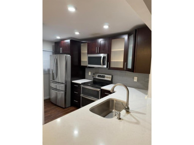 Experience the best of Pine Island Ridge in this spacious rarely