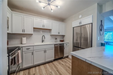 This 3 bedroom, 2 bath condo is sleek, modern & truly move-in