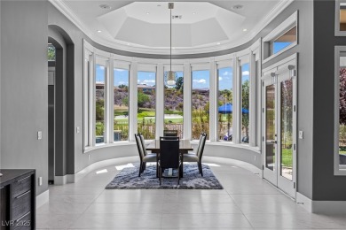 Wake up to panoramic golf course views at this custom home