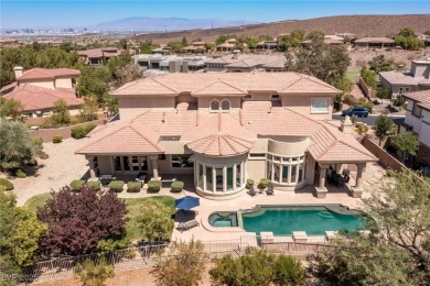 Wake up to panoramic golf course views at this custom home