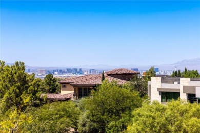 Wake up to panoramic golf course views at this custom home
