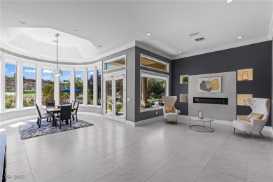 Wake up to panoramic golf course views at this custom home