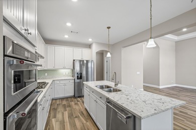 Welcome to this stunning nearly 3,000 sq. ft. all-brick home