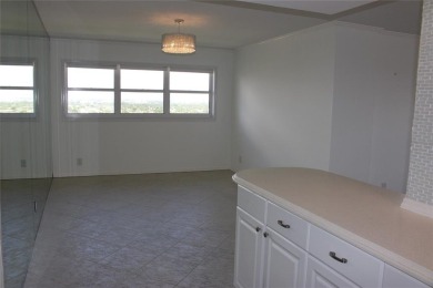 THIS SPACIOUS CORNER PENTHOUSE FEELS LIKE A HOME. SITTING ON A