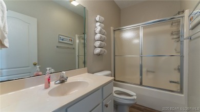 Enjoy incredible lake views from this spacious 4-bedroom, 3-bath