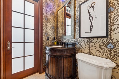 Elegant  2-story residence sited on private lushly-landscaped