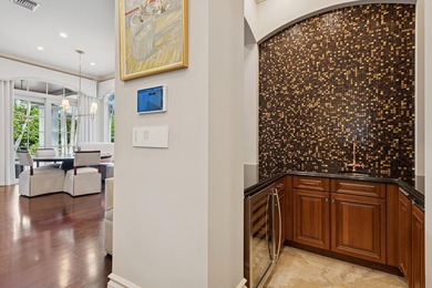 Elegant  2-story residence sited on private lushly-landscaped