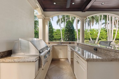 Elegant  2-story residence sited on private lushly-landscaped