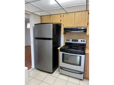 Located in the private, gated community of Miller Gardens, this