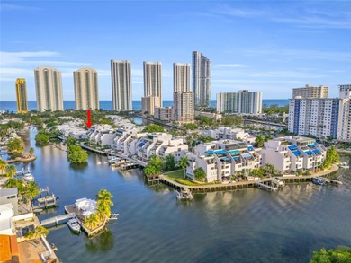 Live on a private, guarded island in Sunny Isles at Poinciana