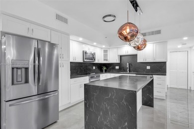 Live on a private, guarded island in Sunny Isles at Poinciana