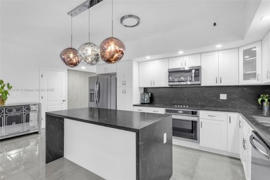 Live on a private, guarded island in Sunny Isles at Poinciana