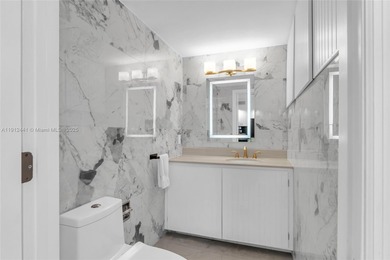 Live on a private, guarded island in Sunny Isles at Poinciana