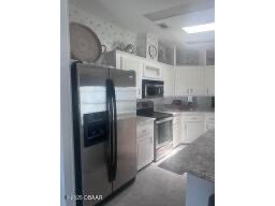 This immaculate home in a 55-plus community is move-in ready and