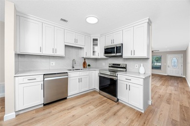 STUNNING CORNER UNIT & GOLFER'S DREAM!This completely remodeled