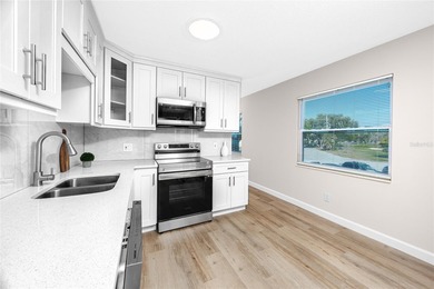 STUNNING CORNER UNIT & GOLFER'S DREAM!This completely remodeled