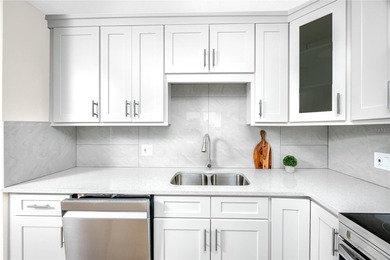 STUNNING CORNER UNIT & GOLFER'S DREAM!This completely remodeled