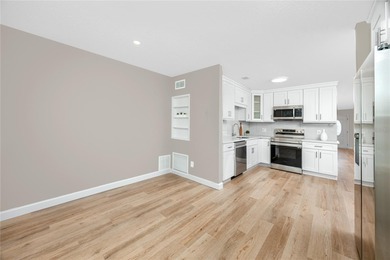 STUNNING CORNER UNIT & GOLFER'S DREAM!This completely remodeled