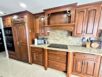 Step into the open-concept living space, where large sliding