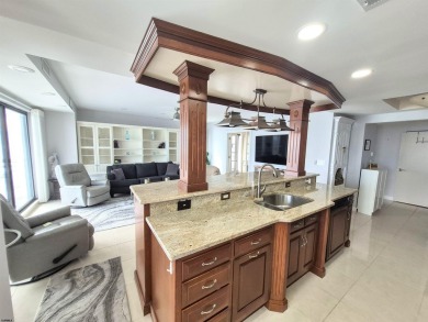 Step into the open-concept living space, where large sliding