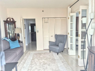 Step into the open-concept living space, where large sliding