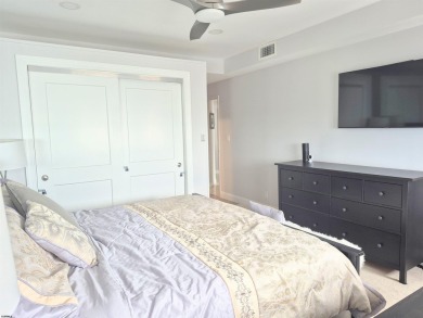 Step into the open-concept living space, where large sliding