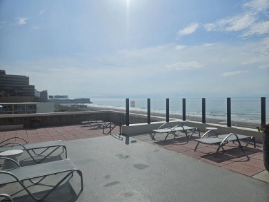 Step into the open-concept living space, where large sliding