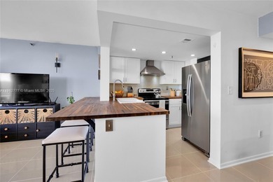 Experience Coral Gables living from this high-floor residence at