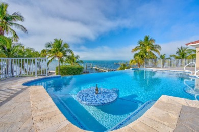 Nestled on a secluded 2-acre lot in Grassy Key, Marathon, this