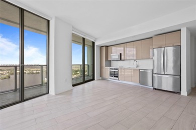 Soaring high on the 25th floor, this sought-after Line 04 unit