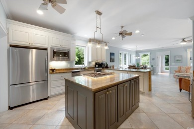 Nestled on a serene 1.88 acre wooded lot, enjoy resort-style