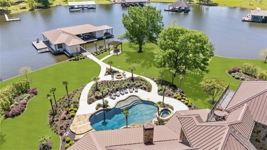 Welcome to the pinnacle of luxury lakefront living on nearly 2