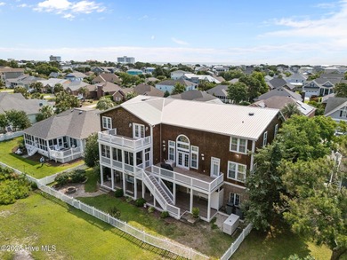 This exceptional 5+ bedroom coastal retreat in the sought-after