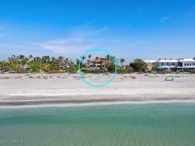 Nestled between the Gulf and Bay, this stunning beachfront home