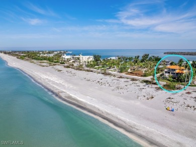 Nestled between the Gulf and Bay, this stunning beachfront home