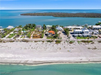 Nestled between the Gulf and Bay, this stunning beachfront home