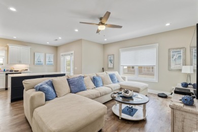 Truly stunning 3-bedroom, 2.5-bath raised beach home located in