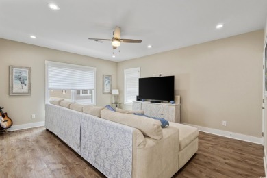 Truly stunning 3-bedroom, 2.5-bath raised beach home located in