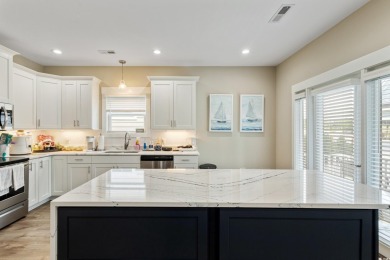 Truly stunning 3-bedroom, 2.5-bath raised beach home located in