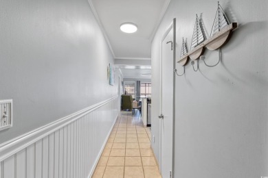 This beautifully updated, rarely available, corner unit, located