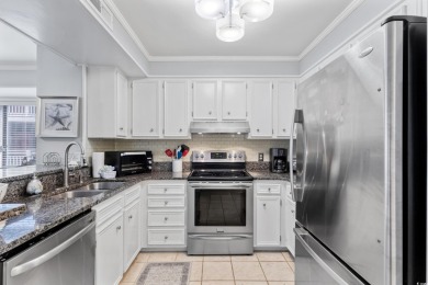 This beautifully updated, rarely available, corner unit, located