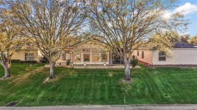 This exceptional home offers stunning views of the golf course