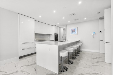 Experience elevated waterfront living in this rarely available