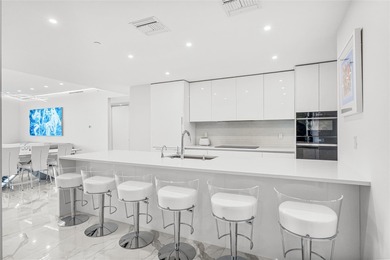 Experience elevated waterfront living in this rarely available